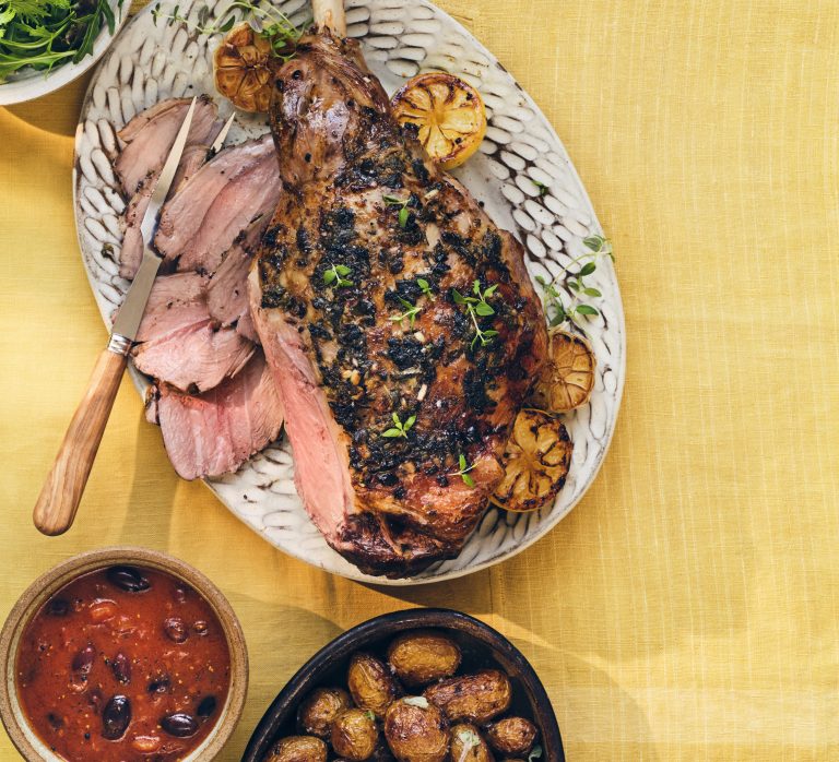 Greek-style roast lamb & new potatoes with tomato olive sauce