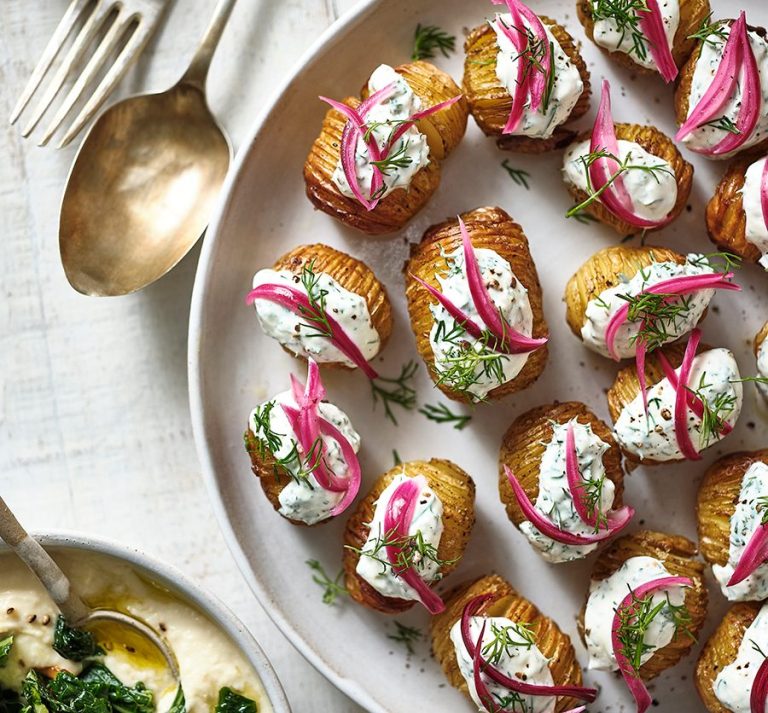Mini hasselbacks with soured cream, dill & pink pickled onions
